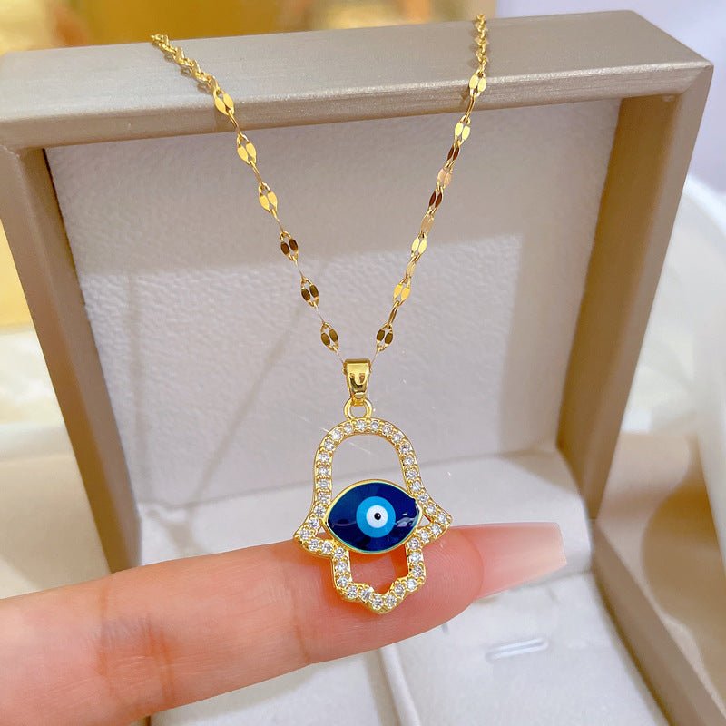 Collier main de Fatma dorée, œil bleu protecteur, strass brillants, modèle Denice