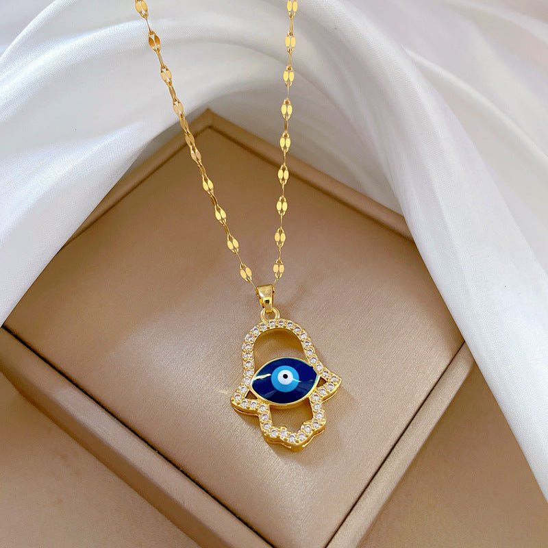Collier main de Fatma dorée, œil bleu protecteur, strass brillants, modèle Denice