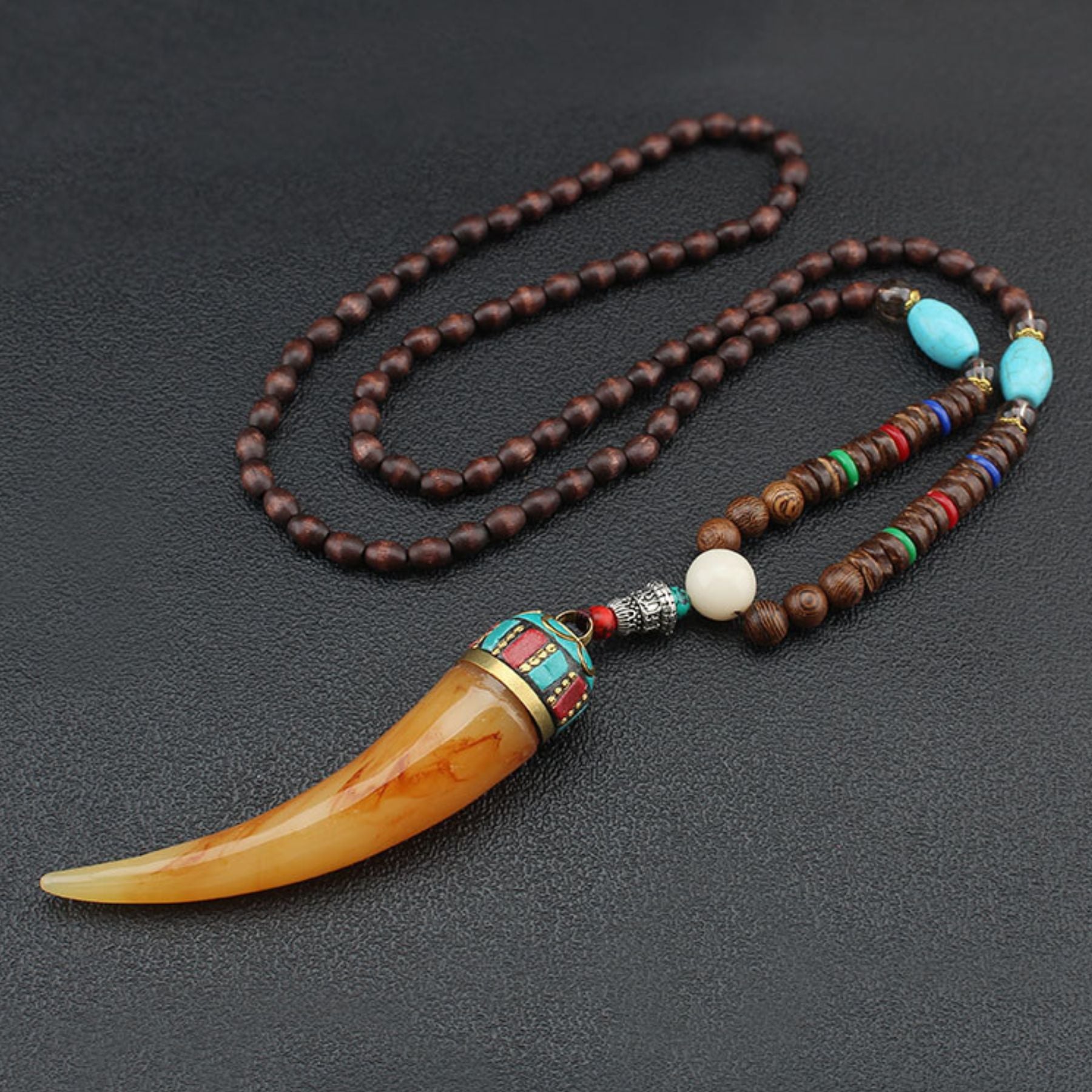 Wooden bead necklace with a resin cow horn pendant, natural stone and metal alloy, bohemian style