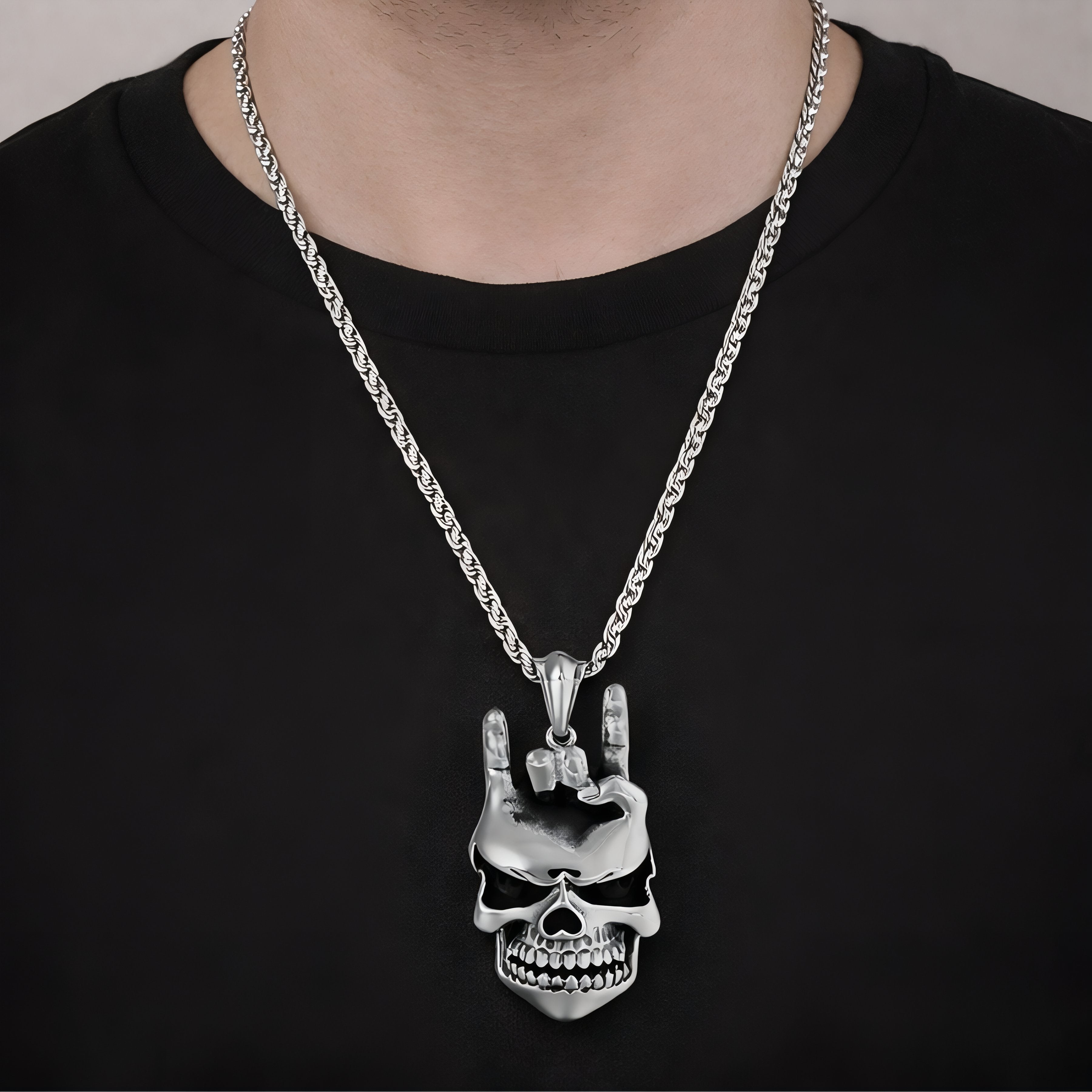 Men's rock necklace with skull pendant and rock hand sign, in stainless steel