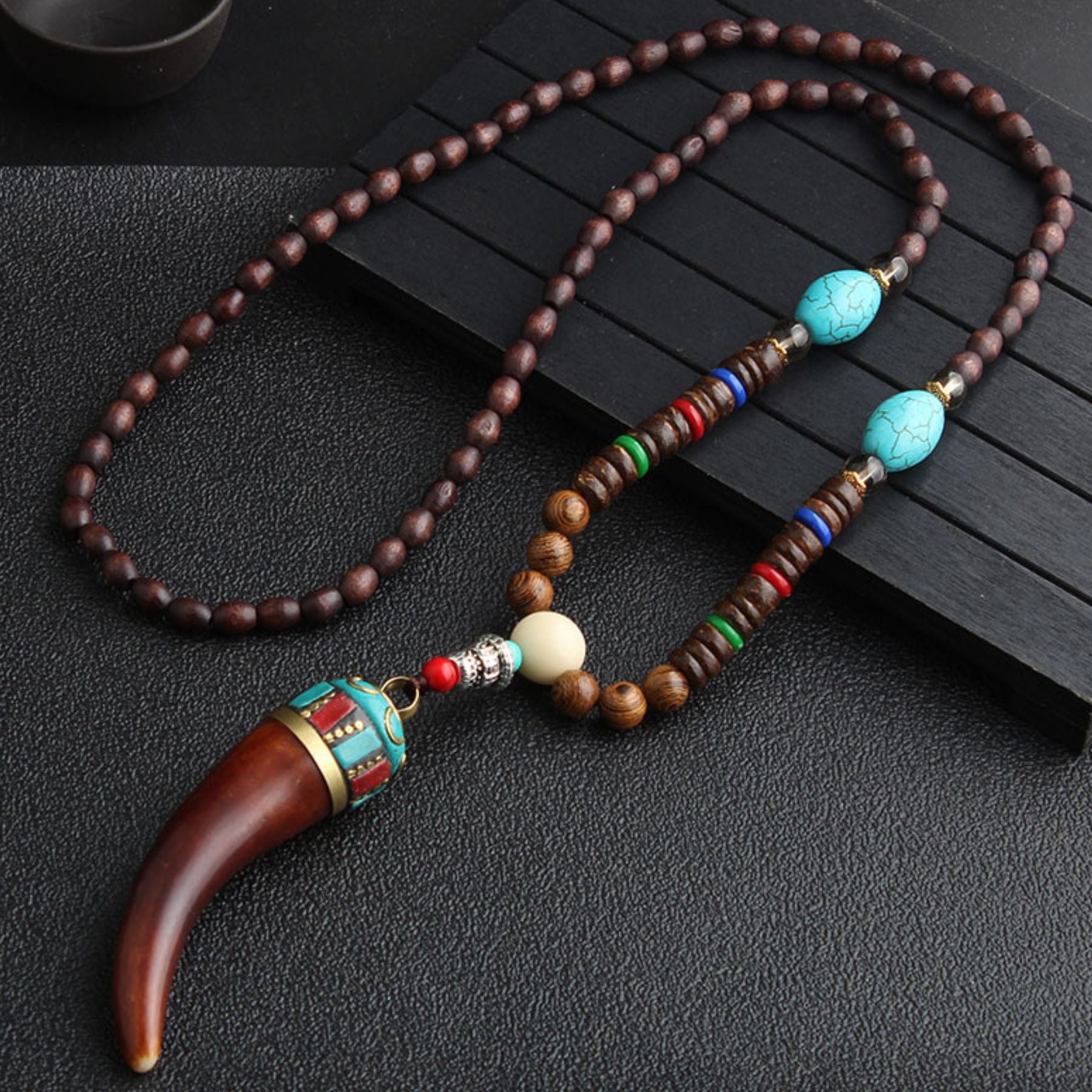 Wooden bead necklace with a resin cow horn pendant, natural stone and metal alloy, bohemian style
