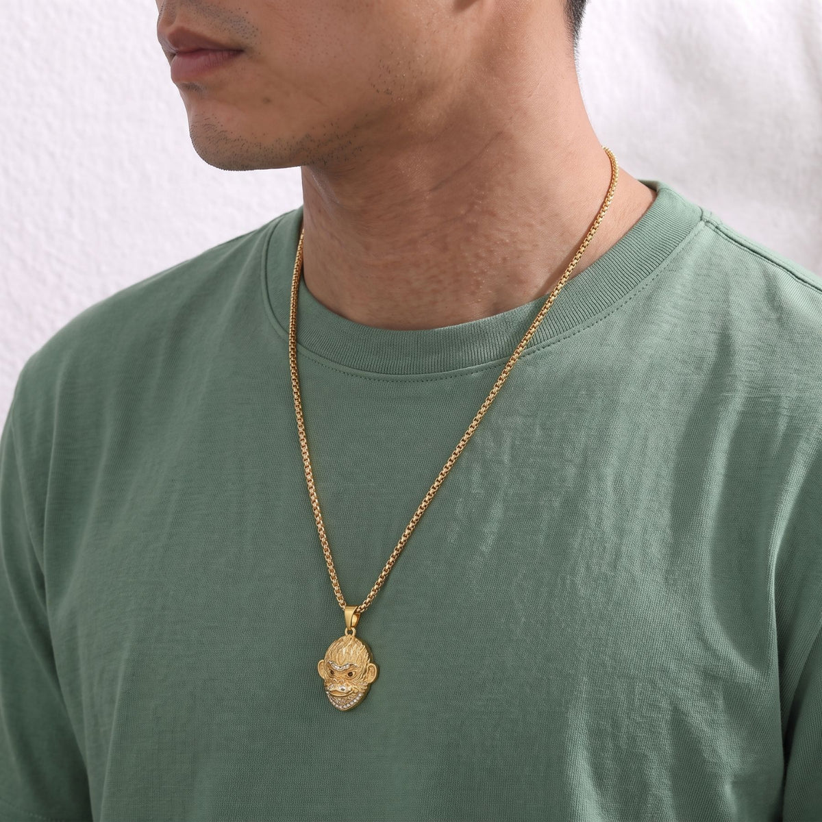 Collier tête de singe pour homme, en acier inoxydable, avec détails scintillants