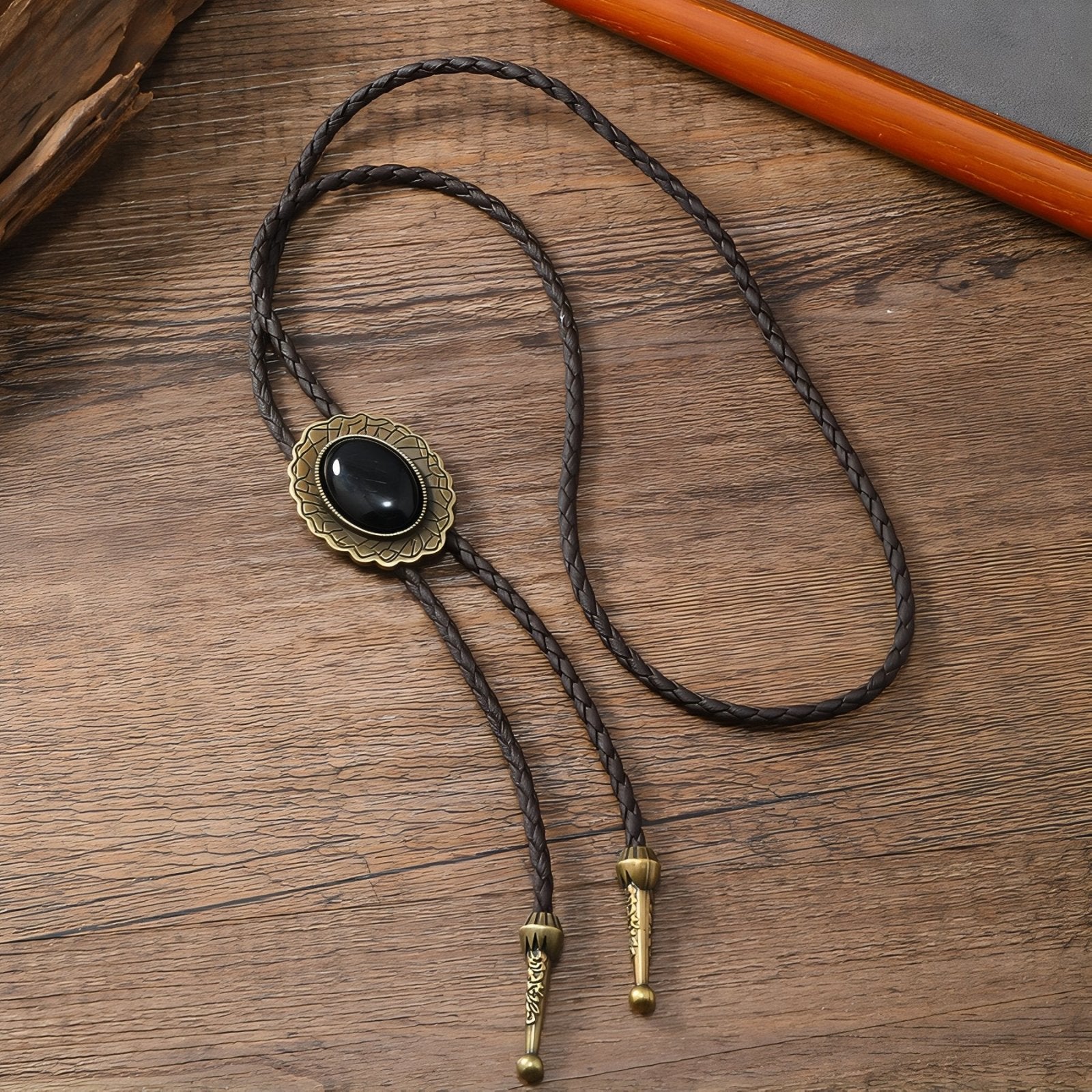 Collier bolo tie unisexe style cow - boy, cuir tressé et pendentif ovale noir, look western vintage