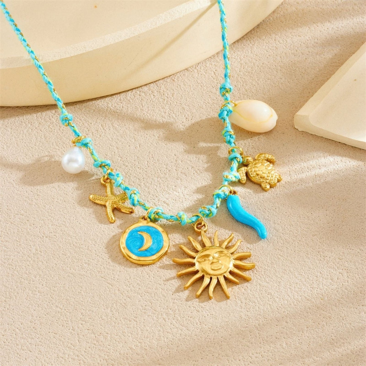 Collier charms soleil pour femme, en acier inoxydable doré, cordon tressé avec tortue et étoile de mer