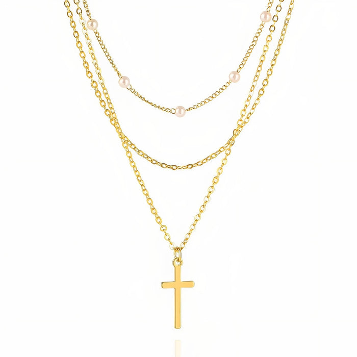 Collier multi-rangs avec pendentif croix et perles blanches