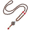 Collier pour femme en perles de bois, avec pendentif amulette de paix orné d'alliage métallique, style bohème