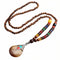 Collier pour femme en perles de bois, avec pendentif goutte en résine orné d'alliage métallique, style artisanale