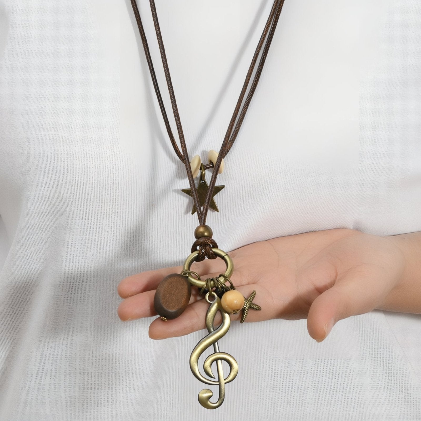 Collier sautoir bohème, pendentif clé de sol, perles en bois et étoile, cordon marron