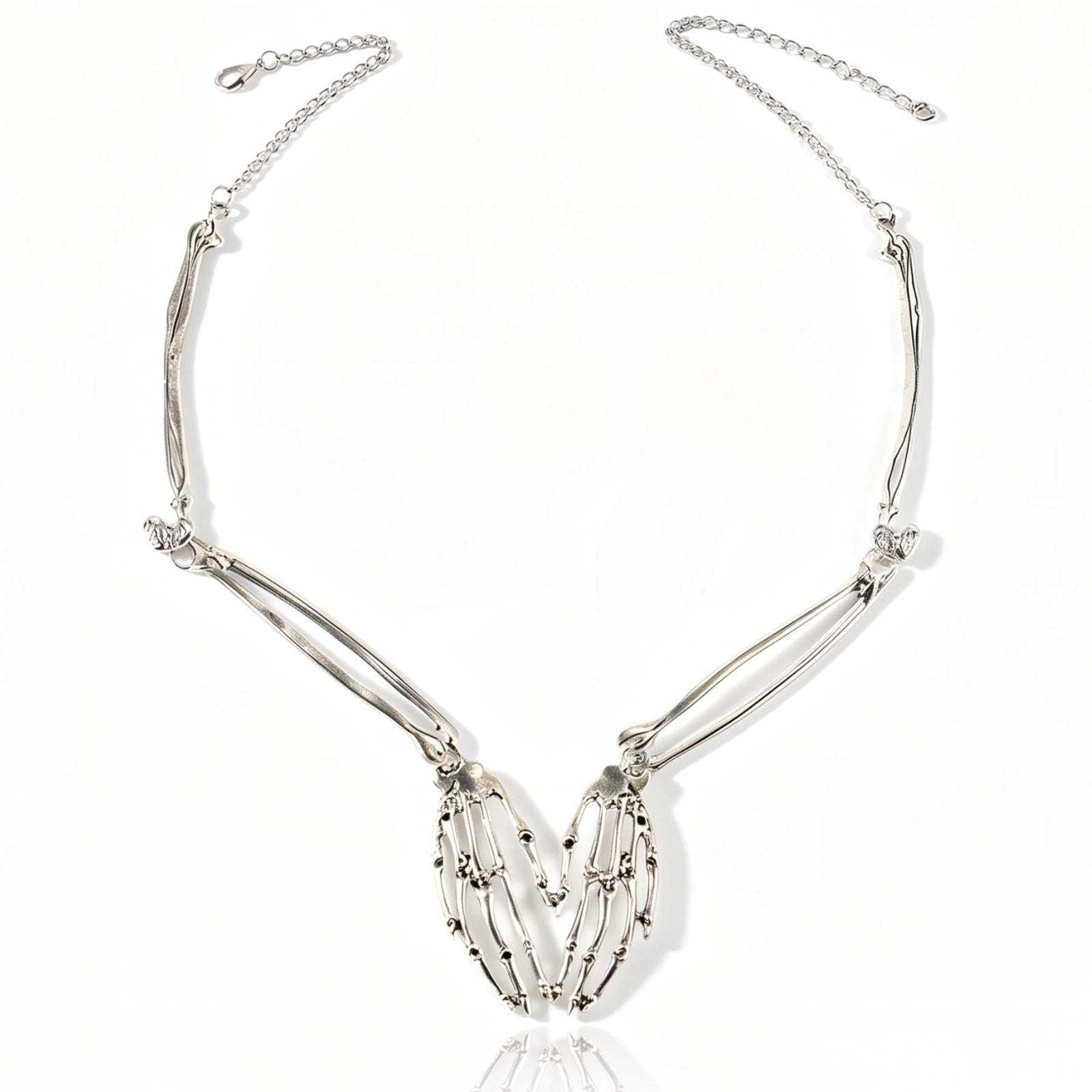 Collier squelette pour femme, en alliage de zinc argenté, avec cœur en mains de squelette