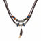 Collier unisexe style tribal, cordon cuir tressé et pendentif griffe ethnique, avec perles en bois et simili cuiret